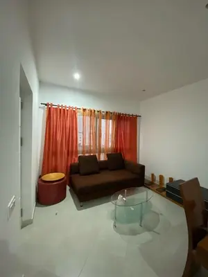 a living room with a couch and a glass table at Apartamento Rua do museu dos Náufragos in Sal Rei