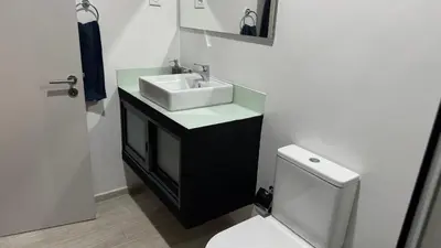 a bathroom with a sink and a toilet at CasaZina in Tarrafal