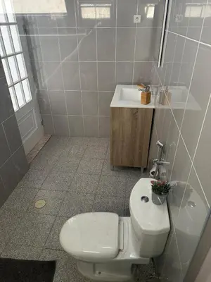 a bathroom with a toilet and a sink at Coração de Santa Maria in Santa Maria