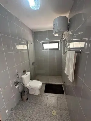 a small bathroom with a toilet and a window at Coração de Santa Maria in Santa Maria