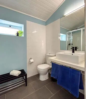 a bathroom with a toilet and a sink and a mirror at Un hogar lejos de tu hogar in Sal Rei