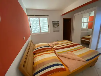a bedroom with two beds with striped blankets at Seaview Luxury Penthouse Mare in Sal Rei