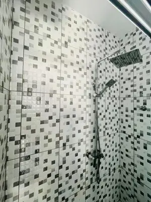 a bathroom with a shower with a glass door at Oásis de retour in Ponta do Sol