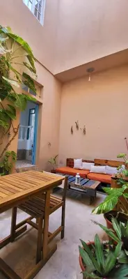 a living room with a couch and a table at Surfhouse Boavista in Sal Rei