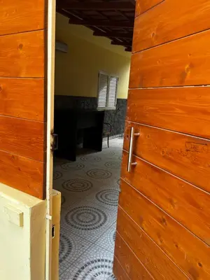 an open door to a room with a floor at sweet single in Santa Maria