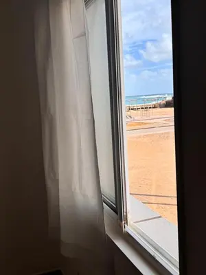 a window with a view of the beach at Sea view - Ca Mauro - Praia Cabral - Wi-Fi in Sal Rei