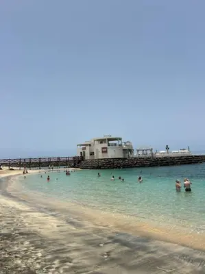 a group of people in the water at the beach at Vida boa é no Vila Verde Sal in Santa Maria