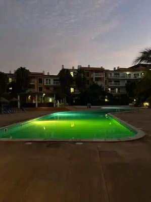 a green light in the middle of a parking lot at Vida boa é no Vila Verde Sal in Santa Maria
