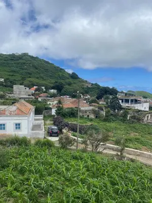 a town on a hill with a car on a road at Villa Vicente Casa Soares in Vila Nova Sintra