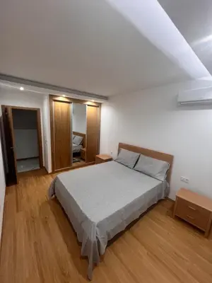 a bedroom with a large bed in a room at Ondas Relax House in Praia