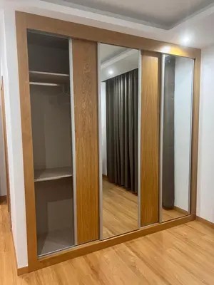 a large mirror in a room with a closet at Ondas Relax House in Praia