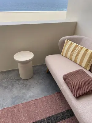 a living room with a couch and a table at Walhalla Seahouse in Chã da Igreja