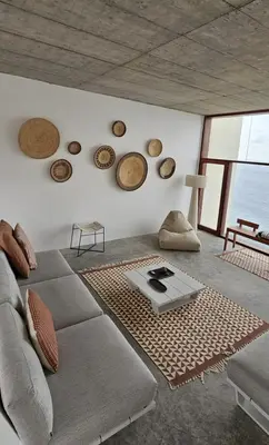 a living room with a couch and plates on the wall at Walhalla Seahouse in Chã da Igreja