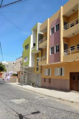 a tall building on the side of a street at Apartamento Moderno in Mindelo