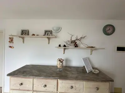 a room with a wooden cabinet and shelves on the wall at FantaSea Apartment Leme Bedje in Santa Maria