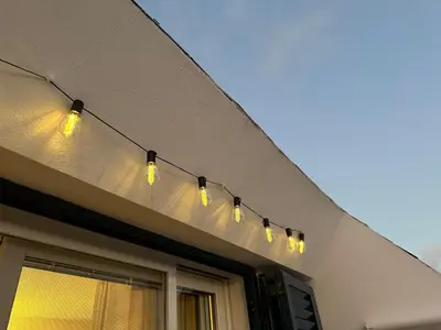 a row of lights on the side of a building at FantaSea Apartment Leme Bedje in Santa Maria