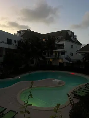 a large swimming pool in front of a building at FantaSea Apartment Leme Bedje in Santa Maria
