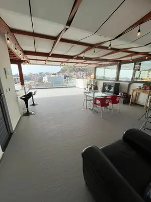 an office with a large room with tables and chairs at Apto Duarte T1 Compacto in Praia