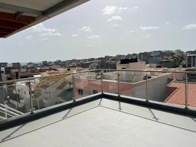 a balcony with a view of a city at Apto Duarte T1 Compacto in Praia