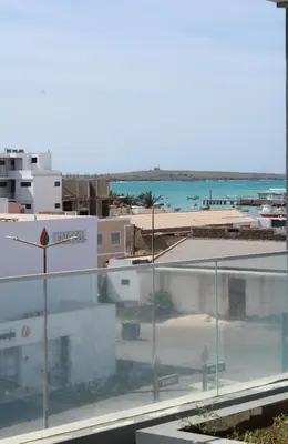 a view of a city with the ocean in the background at APARTAMENTO T2 - SAL REI - Boa Vista in Sal Rei