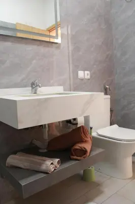 a bathroom with a sink and a toilet at APARTAMENTO T2 - SAL REI - Boa Vista in Sal Rei