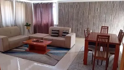 a living room with a couch and a table at Elite Residences MVT in Praia