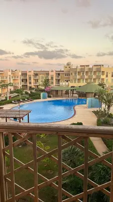 a large swimming pool in front of a building at Tropical Paradise in Santa Maria