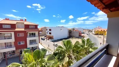 a view from a balcony of a street with palm trees at Pensao Porta do Vento in Santa Maria