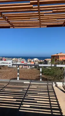 a view of the ocean from a balcony of a building at Casa Branca in Ponta do Sol