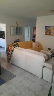 a living room with a couch and a table at Apartamento Mi in Praia