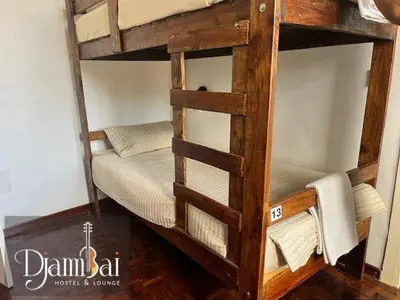 a couple of bunk beds in a room at Hostel Djambai in Mindelo