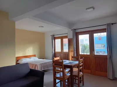 a bedroom with a bed and a table and chairs at One cozy bedroom - Studio in Santa Maria in Santa Maria