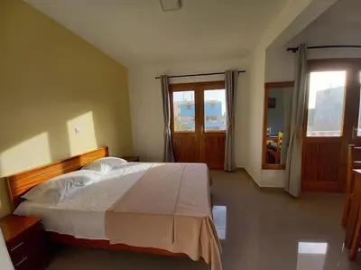 a bedroom with a large bed and a window at One cozy bedroom - Studio in Santa Maria in Santa Maria