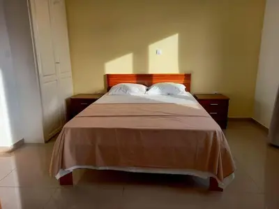 a bedroom with a large bed with two pillows at One cozy bedroom - Studio in Santa Maria in Santa Maria