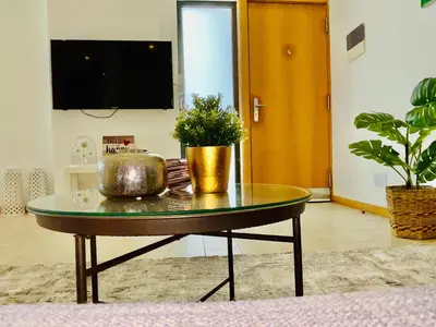 a coffee table with a plant on top of it at Sal Little Heart Apartment 21 in Santa Maria