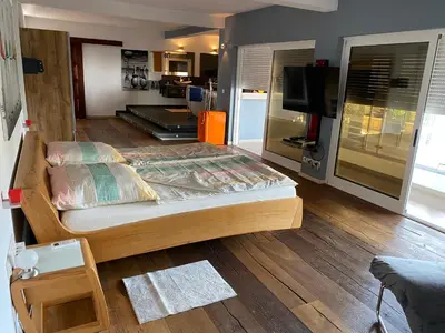 a bedroom with a bed and a television in it at Zweite Heimat - Townhouse Boa Vista in Sal Rei