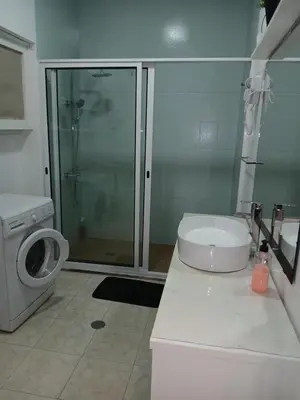 a bathroom with a shower and a toilet and a sink at Flat Mindelo Deluxe 30 in Mindelo
