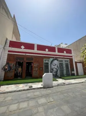 a building with a face on the front of it at La Piazza in Santa Maria