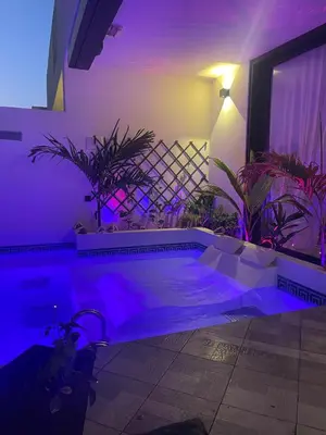 a swimming pool with purple lighting in a house at Luxury Paradise Beach Lagoon in Sal Rei
