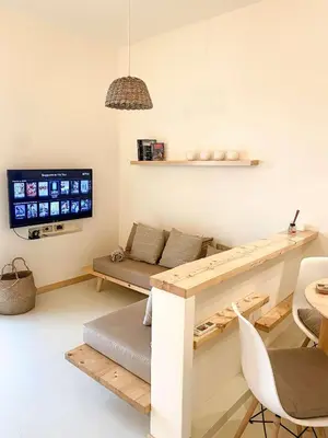 a living room with a couch and a table at Casa da Leoa in Sal Rei