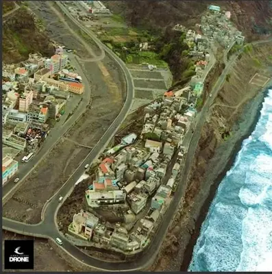 an aerial view of a town next to the ocean at Residencial Bibi in Ribeira Grande