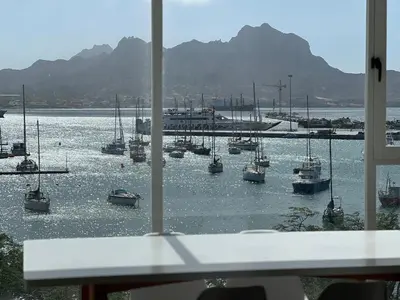 a view of a harbor with boats in the water at Apartamentos Baia Marginal 1 in Mindelo