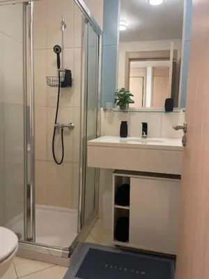 a bathroom with a shower and a sink at Cactus Gold Vila Verde in Santa Maria