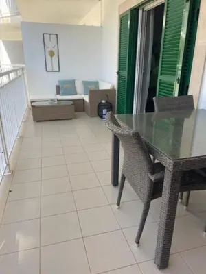 a dining room with a glass table and chairs at Cactus Gold Vila Verde in Santa Maria