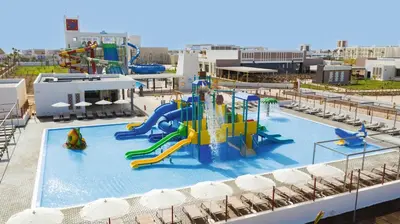 a large pool with a water park with slides at Hotel Riu Palace Santa Maria - All Inclusive in Santa Maria