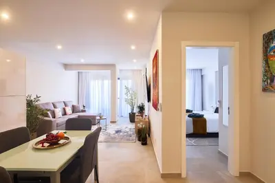 a living room with a dining table and a living room at Apartamentos Golfinho Dourado `Edifício Lux,s in Santa Maria