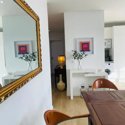 a dining room with a mirror and a table at Sal Little Heart Grand Terrace Apartment 26 in Santa Maria
