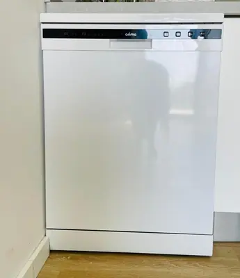 a white dishwasher sitting next to a white refrigerator at Sal Little Heart Grand Terrace Apartment 26 in Santa Maria
