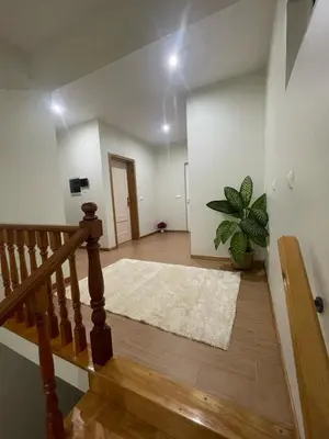 an empty room with a staircase and a potted plant at Conforto ,Natureza e Relaxamento in Carvoeiros