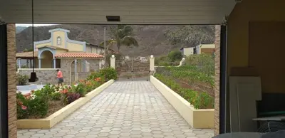 a walkway leading to a house with a garden at Conforto ,Natureza e Relaxamento in Carvoeiros